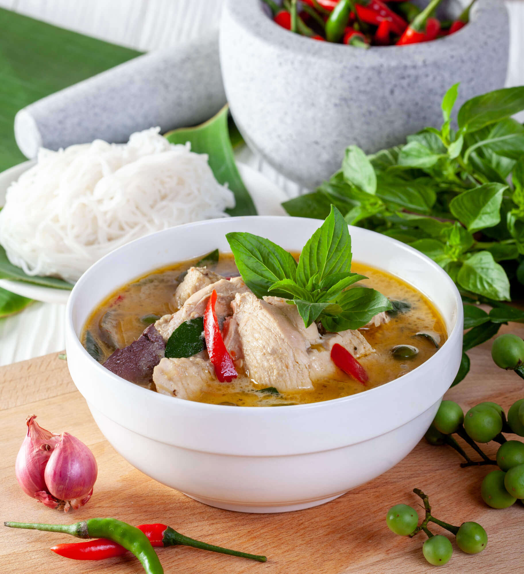 green curry with chicken wooden background thai cuisine 1 1